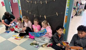 Students lined up on a wall activity